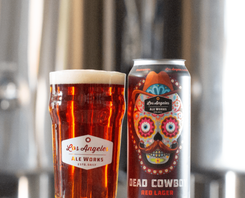 Dead Cowboy beer in glass next to can