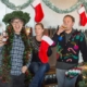 Three people dressed in holiday gear