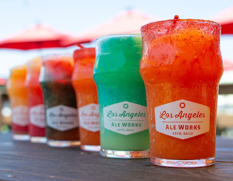 rainbow colored lineup of beer slushies