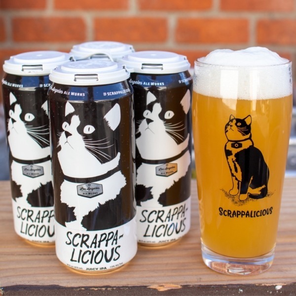 Four pack of Scrappalicius Juicy IPA cans next to a pour of beer in a glass with "Scrappalicious" cat artwork printed on it