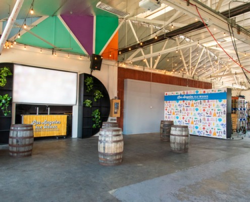 Private Event Space w/ screen and barrels in a brewery space