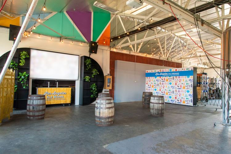 Private Event Space w/ screen and barrels in a brewery space