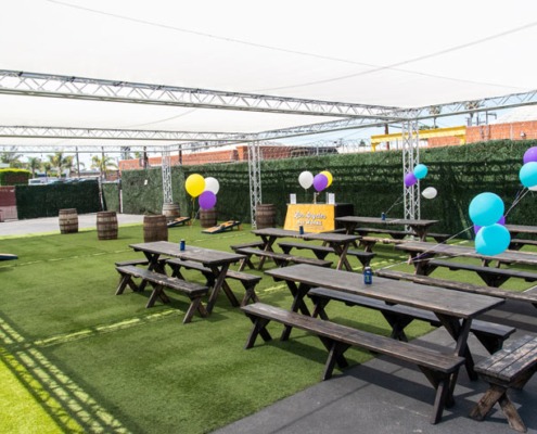Outdoor Private Event Space with barrels and balloons
