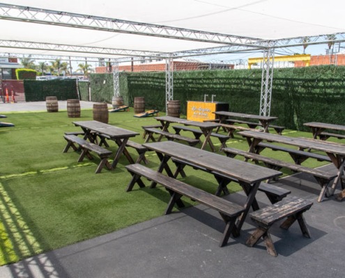 Outdoor Private Event Space with barrels and tables