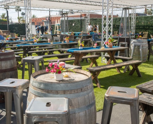 Picnic tables and barrels set up for a special event