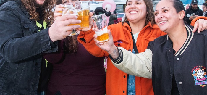 Group of friends toasting with beer