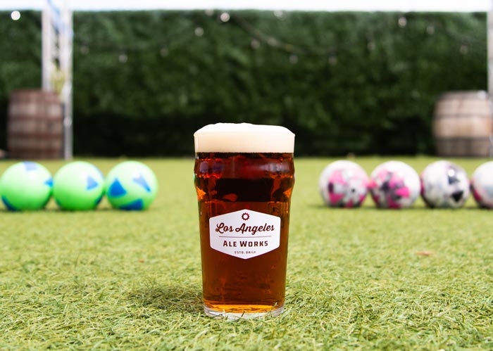 Glass of beer with Bocce balls