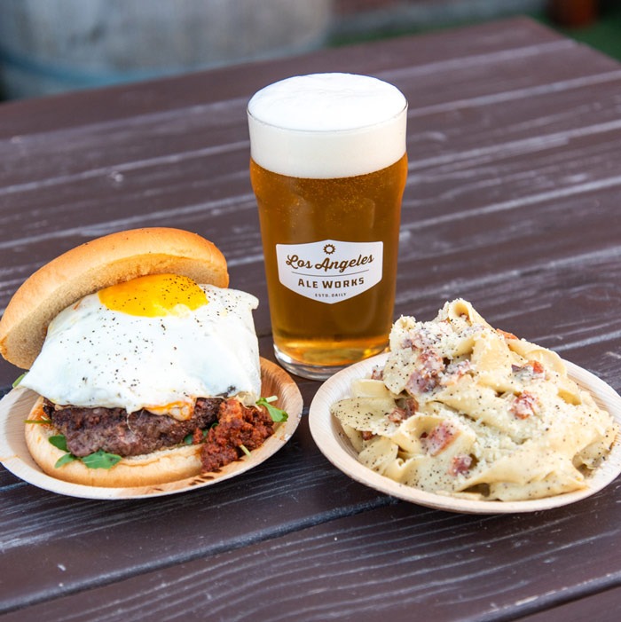 Burger, pasta and glass of beer